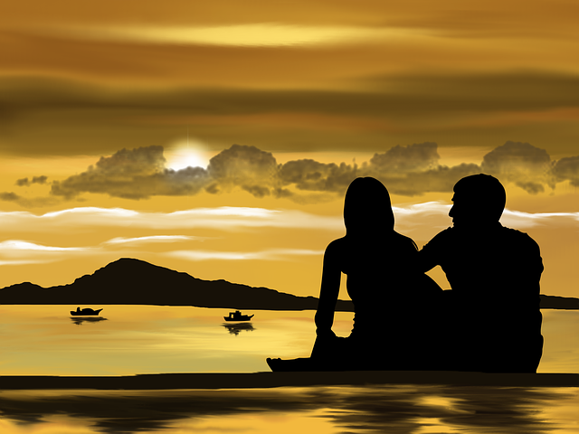 夕陽を眺めるカップル